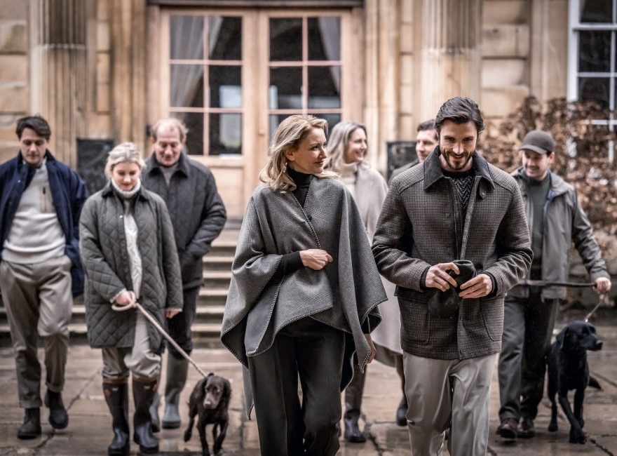 A group of people walking outside, wearing Purdey clothes