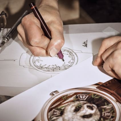 A person drawing sketches for new designs for a watch