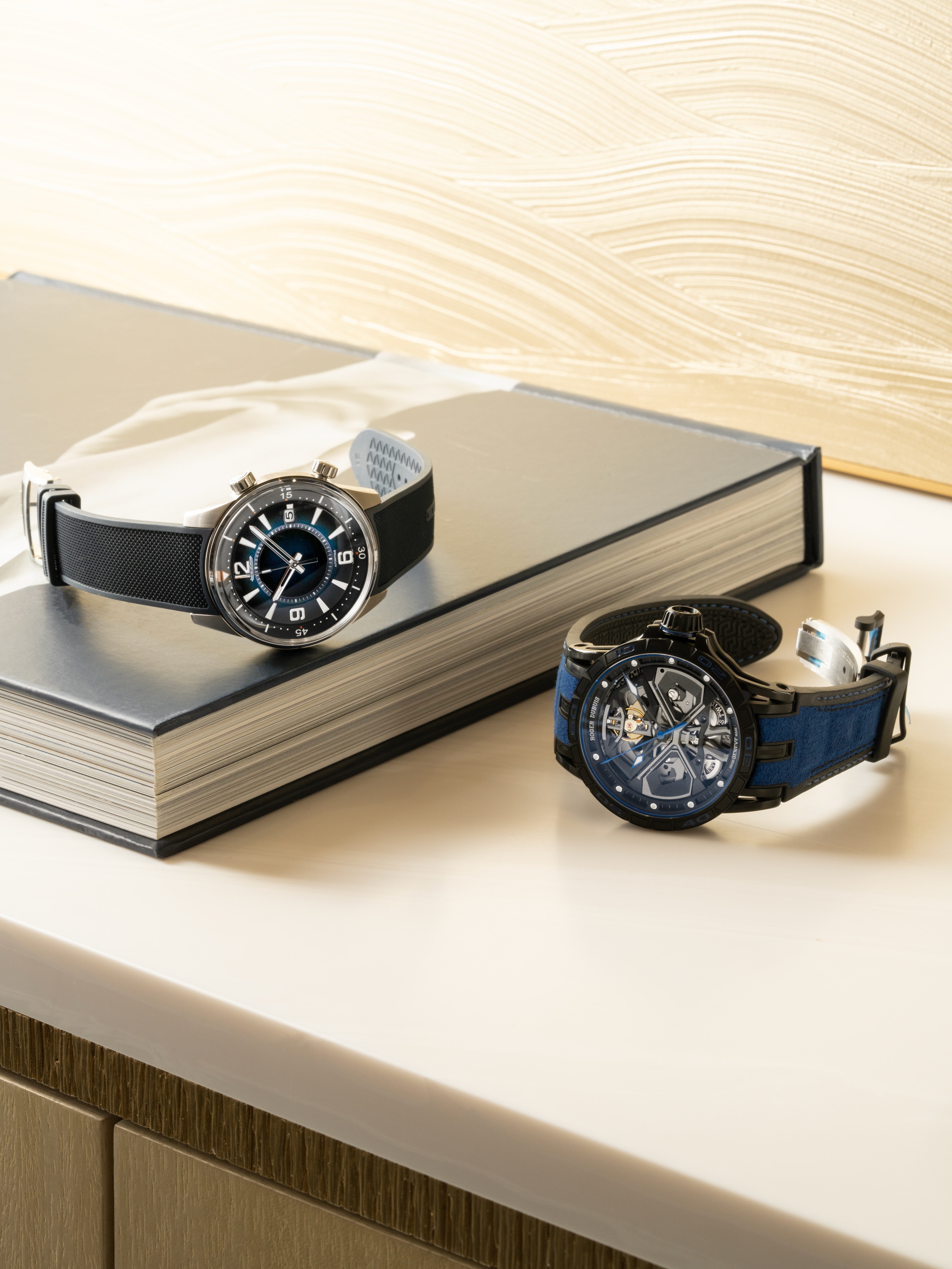 2 watches shown on a desk