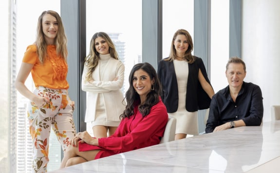 A diverse group of workers in a conference room at Richemont's premises