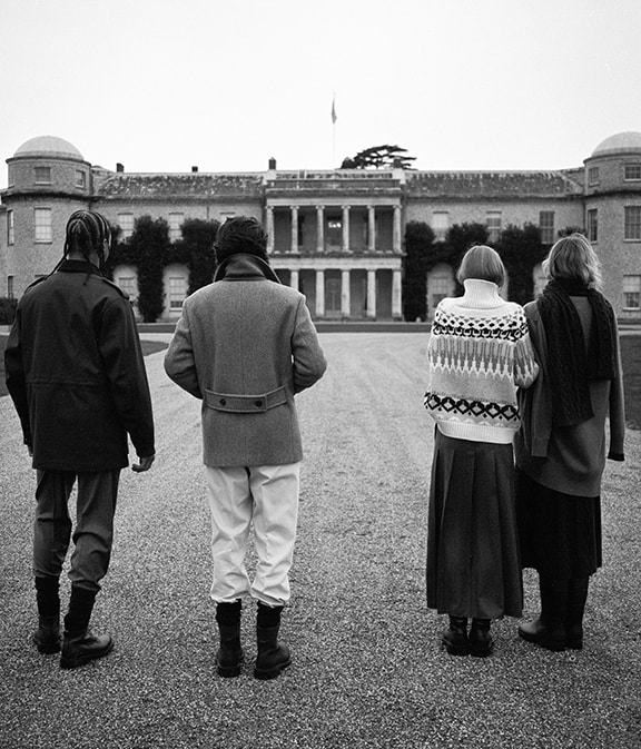 Group of 4 people looking at a castle