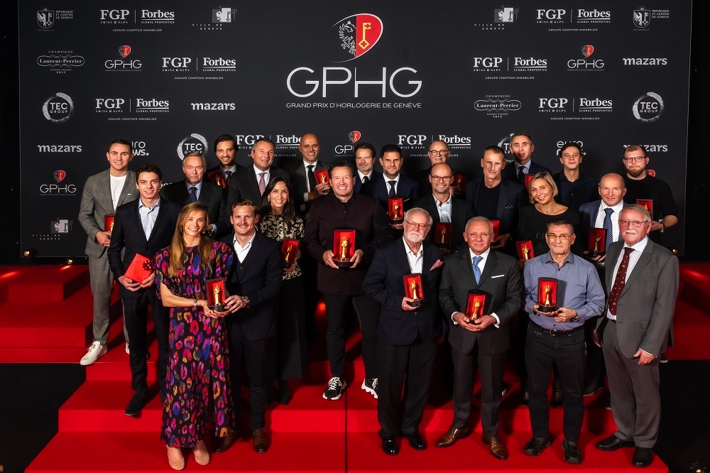 A group of people posing with prizes