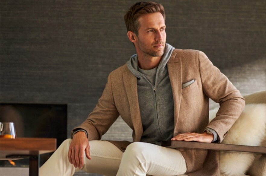 Peter Millar model sitting a chair