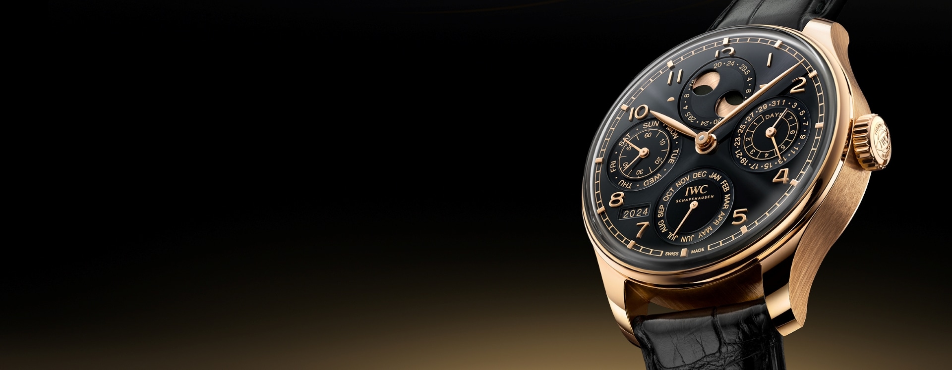 A watch with black shield and a black leather strap