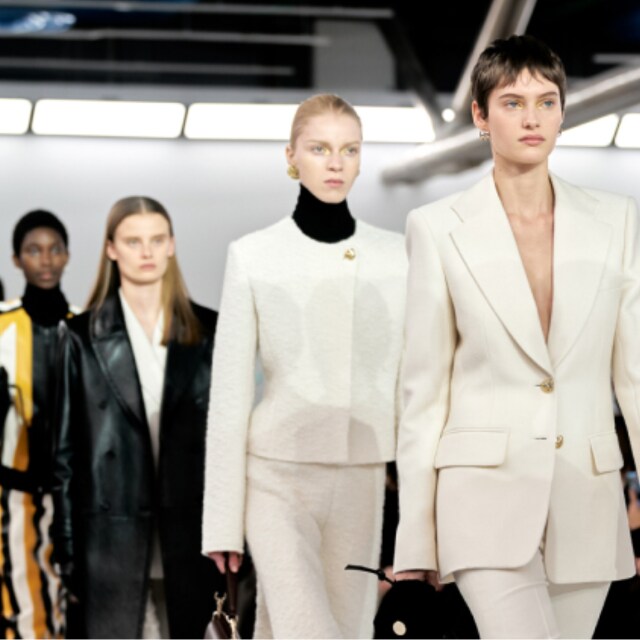 Women showcasing stunning fashion designs on the runway