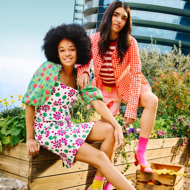 Two women in colourful dresses